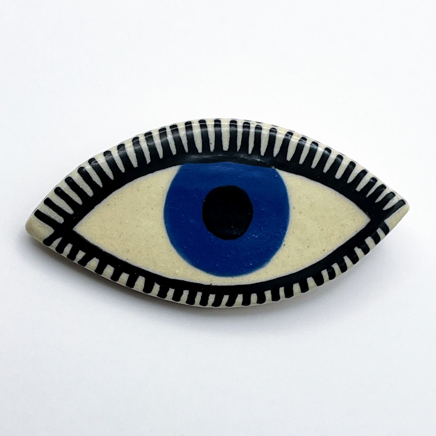 Here and Here: Blue Eye Brooch with Fine Line Lashes Product Image 1 of 2