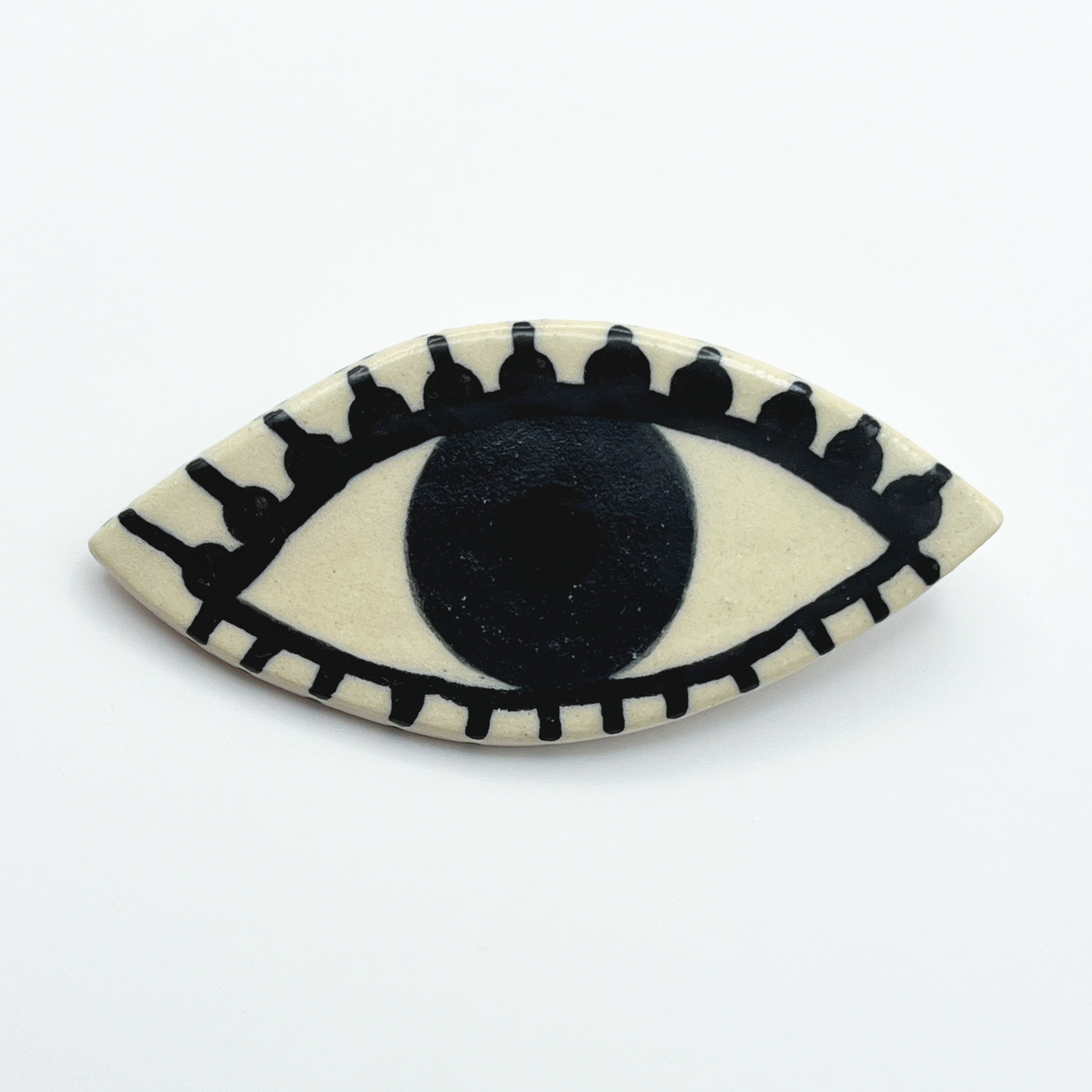 Here and Here: Green and Black Eye Brooch with Dotted Lashes Product Image 1 of 2