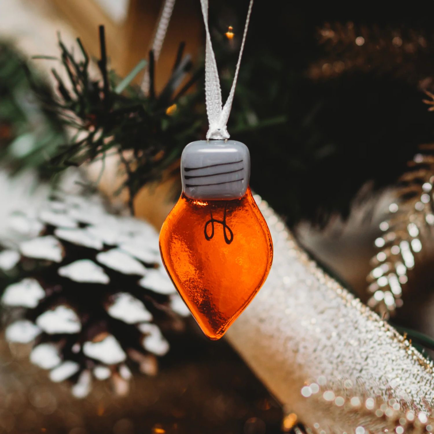 Station Pôle Nord: Light Bulb Ornament – Orange Product Image 1 of 1