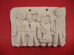 Family portrait carved in clay