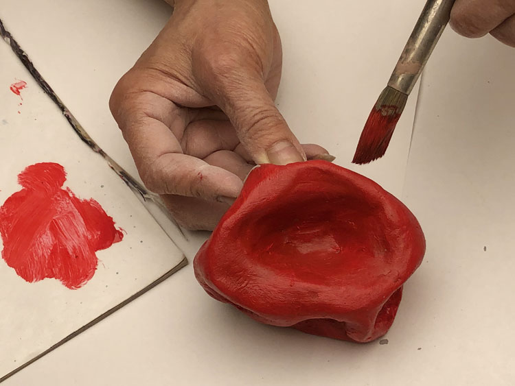 Painting a sculpture red