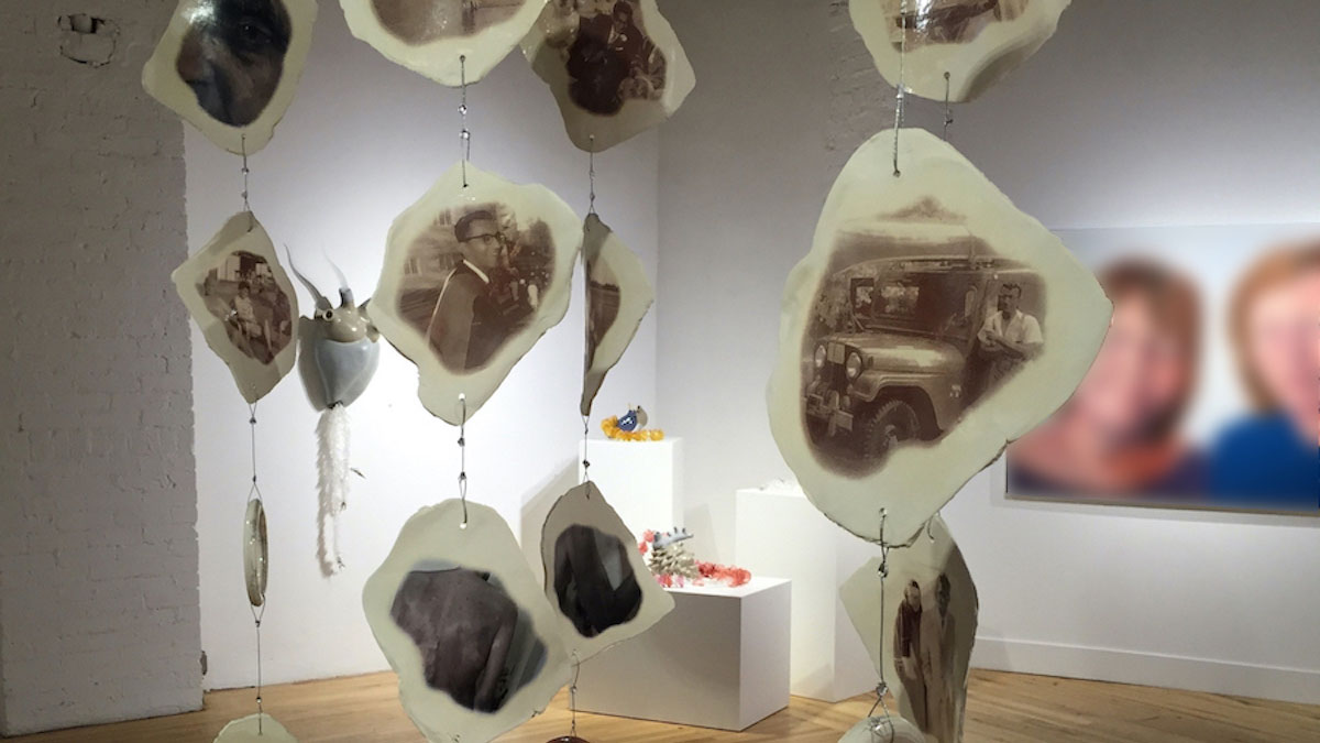 Hanging ceramic shapes with photographs