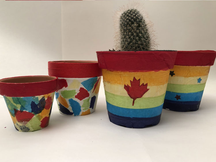 Colourful pots decorated with tissue paper