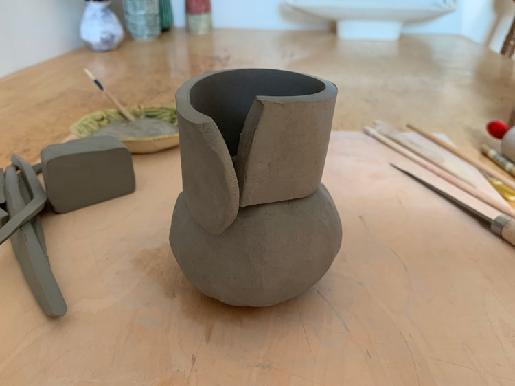 Small clay pot with a clay neck