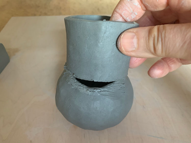 Attaching a clay neck to a pinch pot