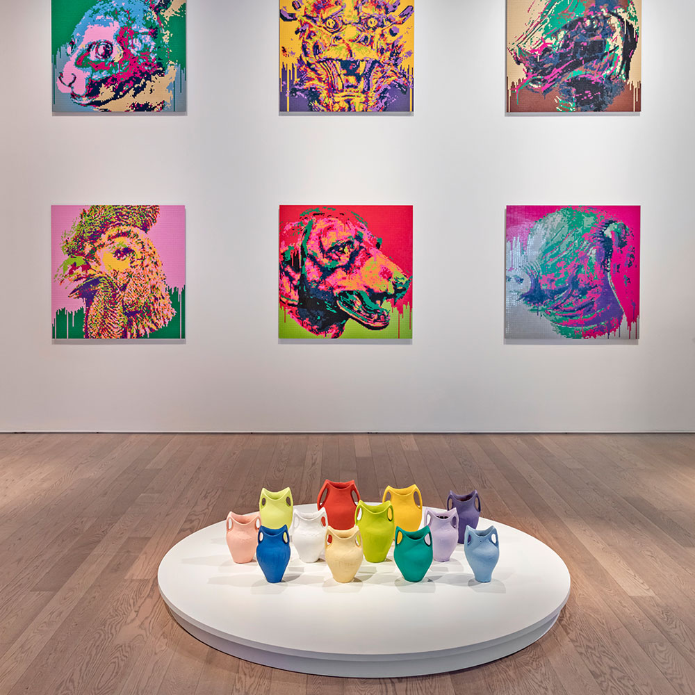 A installation by Ai Weiwei of colourful ceramic pots and Lego portraits of the Chinese zodiac