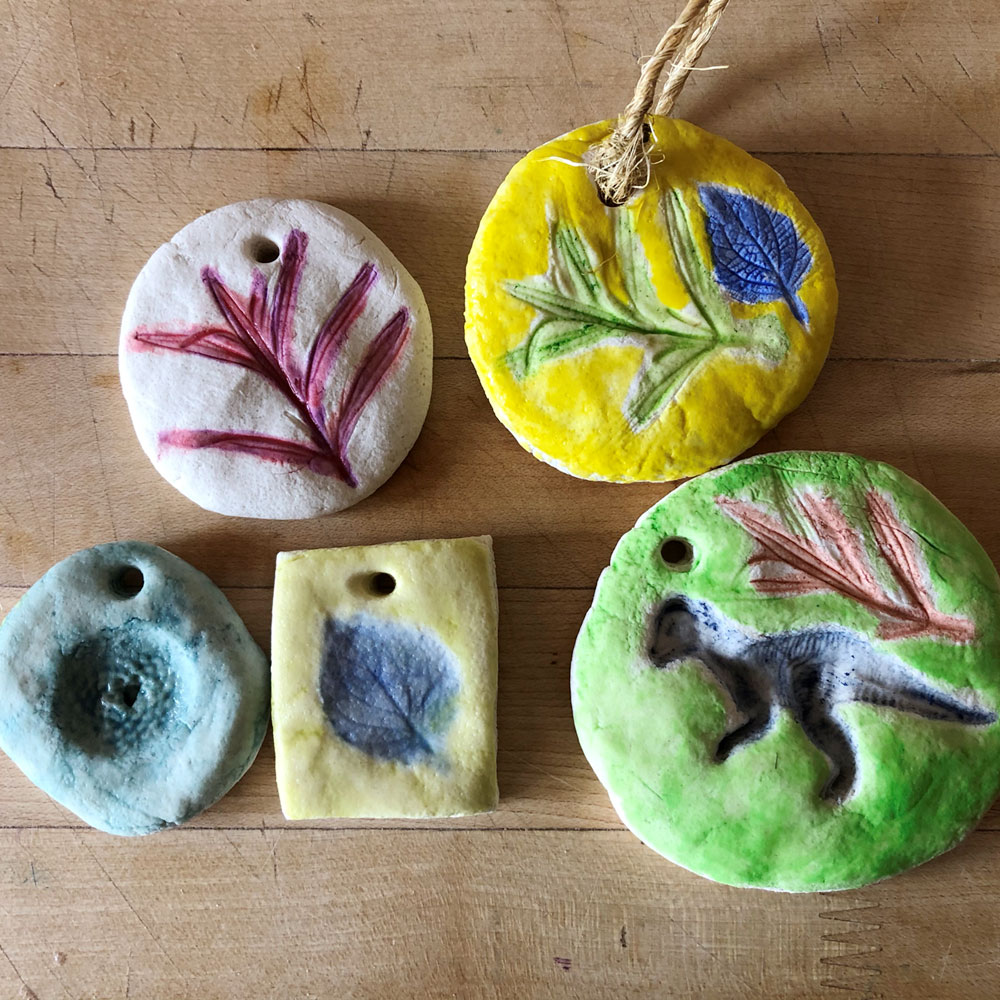 Clay medallions with painted impressions