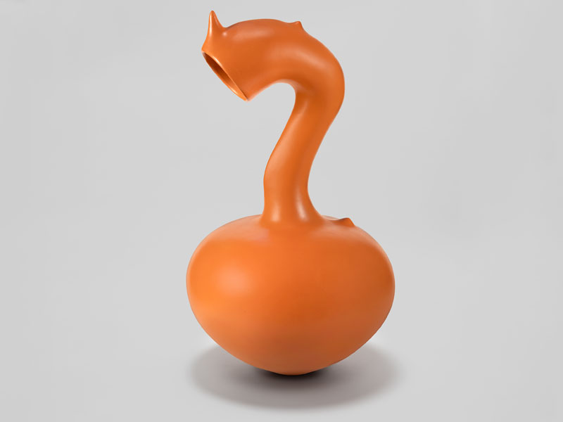 An orange ceramic vessel with a round belly and a curved neck with small protrusions