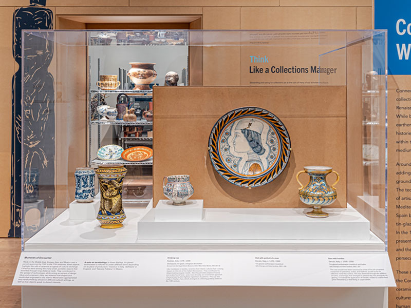 Colourful ceramic objects in a glass case